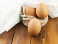 Brown three egg in a nest of twine for Happy Easter Royalty Free Stock Photo