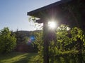 Brown tiber wooden gazebo or pergola with climbing plants and fl Royalty Free Stock Photo