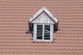 Brown Tiled Roof Of A Detached House. Ventilation Window