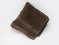 Brown towel, bath towel isolated on white