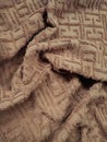 texture and background of a brown towel with a maze-like winding line pattern Royalty Free Stock Photo