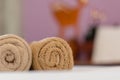 brown towels rolls on bed sheet in the hotel