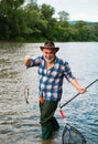 Brown trout being caught in fishing net. Trout. Lure fishing. Fishing - relaxing and enjoying hobby. Fish head and Royalty Free Stock Photo