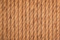 Brown twisted rope in aline. Brown and yellow rope textured background. Rope pattern for background.