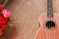 Brown Ukulele Lay on Old Brown Wood Table Royalty Free Stock Photo
