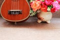 Brown Ukulele Lay on Old Brown Wood Table Royalty Free Stock Photo