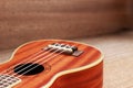 Brown Ukulele Lay on Old Brown Wood Table Royalty Free Stock Photo