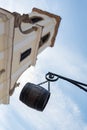 Brown vine barrel hanging on chain in front of church