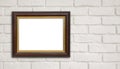 Brown vintage picture frame on white brick wall with copyspace Royalty Free Stock Photo