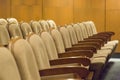 Brown vintage seats armchairs in theater. Theater or conference room interior. Royalty Free Stock Photo