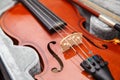 Brown vintage violin with bow lying in a case Royalty Free Stock Photo