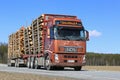 Brown Volvo FH Hauls Timber on Beautiful Day