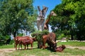Brown Watusi Bulls and a giraffe