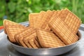 Brown Wheat biscuits in the steel plate with blury background. Tea Biscuit morning breakfast Royalty Free Stock Photo