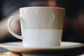 Brown white coffee mug in a restaurant Royalty Free Stock Photo