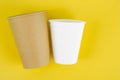 Brown and white color paper drink glass disposable on yellow background