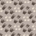 Brown and white crown silhouettes seamless pattern. Hand drawn print with grey background