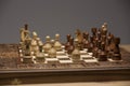 Brown and white figures on chess desk