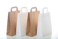 Brown and white paper shopping bags on white background Royalty Free Stock Photo