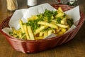 Brown wicker basket with french fries