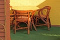 Brown wicker chairs and a glass round table Royalty Free Stock Photo