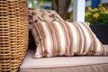 brown wicker cushion under an awning