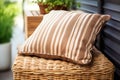 brown wicker cushion under an awning