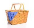 A brown wicker picnic basket on a white background with gingham cloth Royalty Free Stock Photo