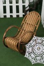 Brown wicker rocking chair is standing Royalty Free Stock Photo