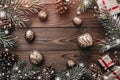 Brown wood background. Fir branches, fir cones and decorative walnuts. gifts for xmas. Christmas greeting card and new year. Royalty Free Stock Photo