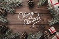 Brown wood background. Fir branches, decorative cones. Message space for Christmas and New Year. Gifts for xmas. Greeting card. Xm Royalty Free Stock Photo