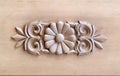 Brown wood carved panel with beautiful floral pattern Royalty Free Stock Photo