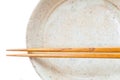 Brown wood chopsticks and white ceramic Royalty Free Stock Photo