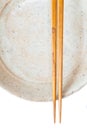 Brown wood chopsticks and white ceramic Royalty Free Stock Photo