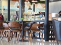 Brown wood curved chair sets crop closeup in a cafeteria coffee shop Royalty Free Stock Photo