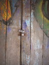 Brown wood door pattern with graffiti paint in Thai style Royalty Free Stock Photo