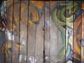 Brown wood door pattern with graffiti paint in Thai style Royalty Free Stock Photo