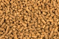 Brown wood pellets texture background. natural pile of wood pellets. organic biofuels. Alternative biofuel from sawdust. The cat Royalty Free Stock Photo