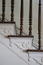 Brown wood picket and spiral cream trim stairs Royalty Free Stock Photo