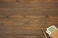 Brown Wood Table With Notebook, Money And Gold Ink Pen Royalty Free Stock Photo