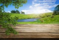 Brown wood table in summer farm green landscape. Royalty Free Stock Photo