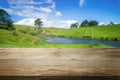 Brown wood table in summer farm green landscape. Royalty Free Stock Photo