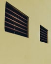 Brown wooden airvent flat colored wall Royalty Free Stock Photo