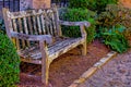 Brown wooden bench with moss growing