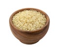 Brown wooden bowl with dry uncooked parboiled rice grain