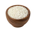Brown wooden bowl with dry uncooked rice grain Royalty Free Stock Photo