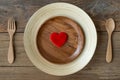 The brown wooden bowl on a rustic table with wooden spoon and fork ,wooden background Royalty Free Stock Photo