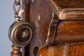 Brown wooden case of an old telephone set with receiver. Old shabby telephone close up on a gray background. Retro phone Royalty Free Stock Photo