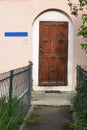 Brown wooden door at front entrance of house