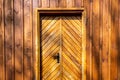 Brown wooden facade and doors of Polish highlander mountain style small chapel in Zywiec Beskid Mountains, Milowka, Poland Royalty Free Stock Photo